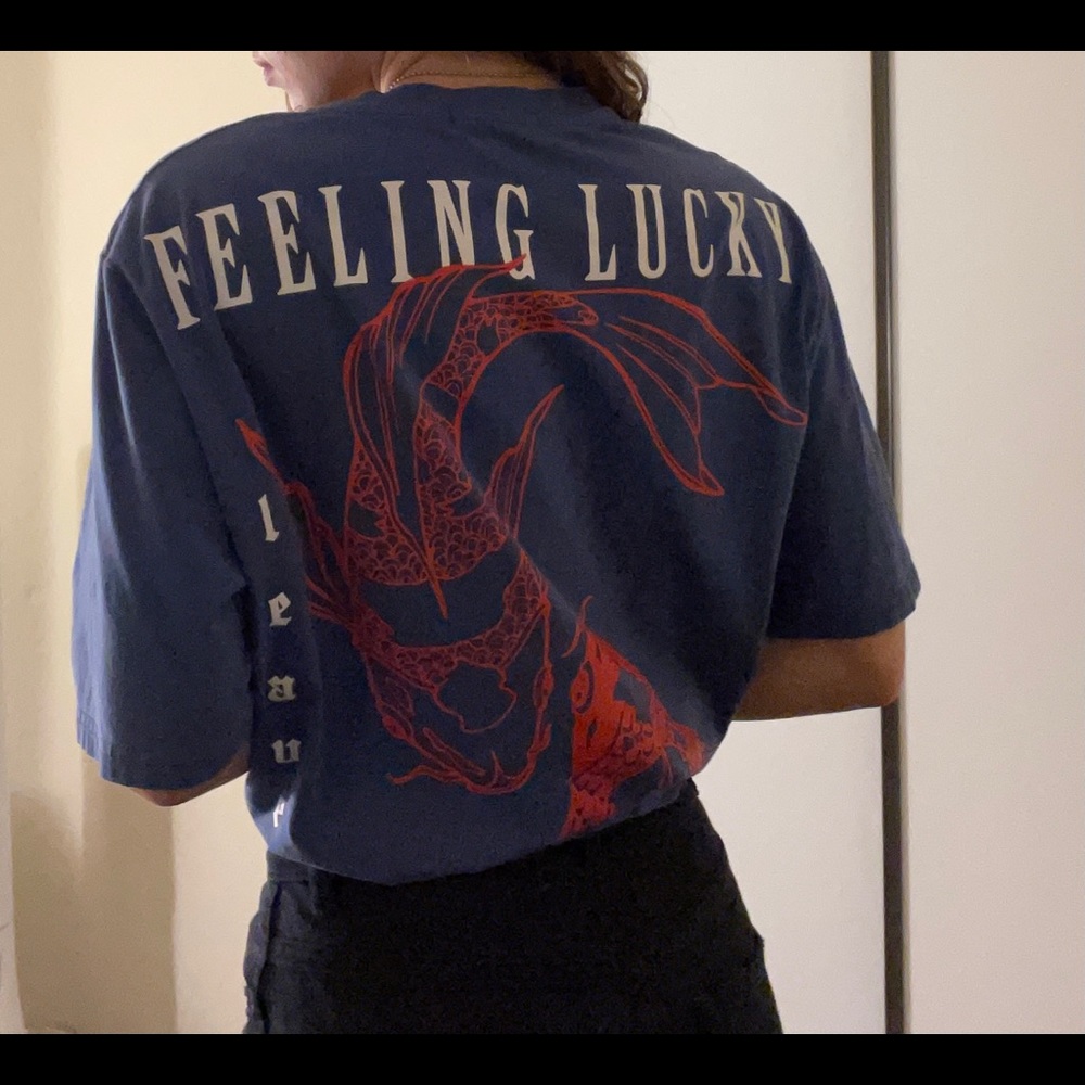 Oversized blue graphic t with the designs in the back